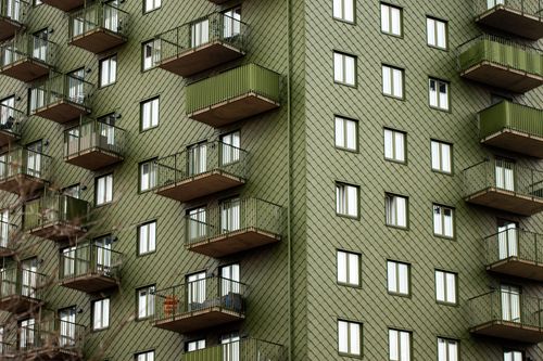 Free Facade of a modern green apartment building with balconies in Gothenburg, Sweden. Stock Photo
