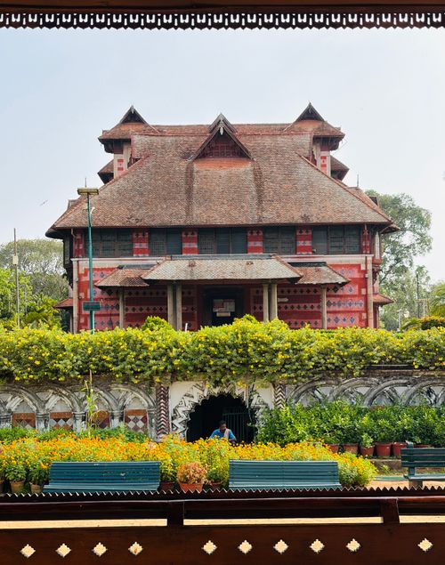 Free The iconic Napier Museum showcasing unique Indo-Saracenic architecture amidst lush gardens. Stock Photo