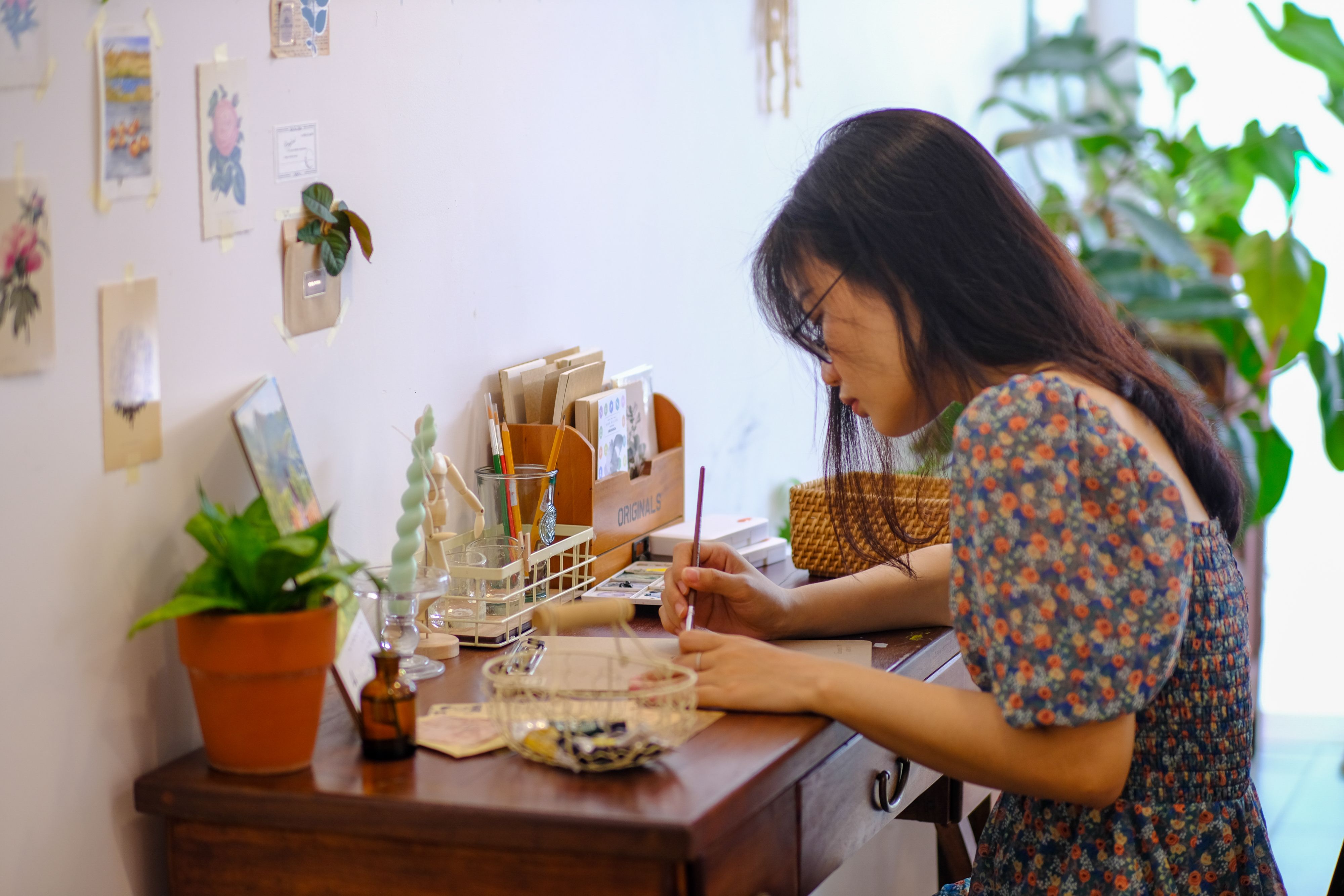 Creative Woman Writing at Cozy Desk in Hue, Vietnam · Free Stock Photo