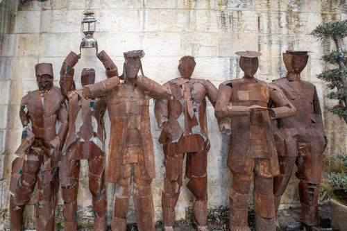 Free Row of rustic metal sculptures depicting figures, located in Gaziantep, Türkiye. Stock Photo
