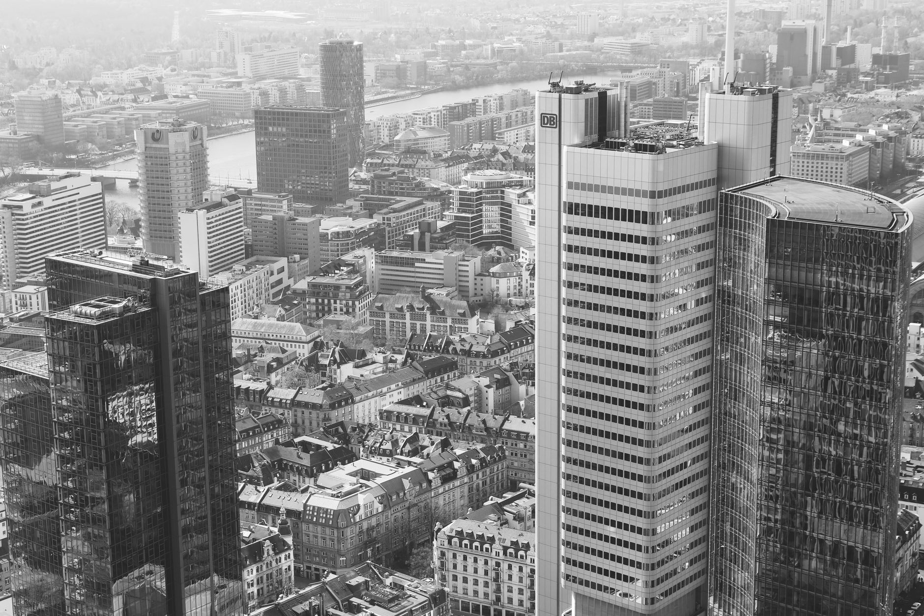 A stunning aerial view of Frankfurt am Main's modern high-rise skyline in black and white.