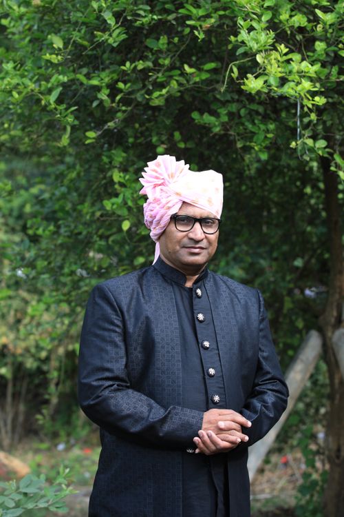 Free Portrait of a man in a traditional Indian outfit with turban outdoors. Stock Photo