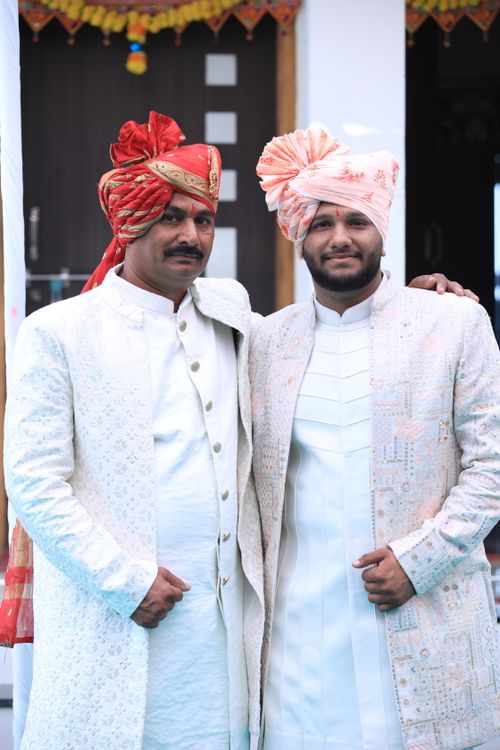 Free Two men in traditional Indian wedding attire, posing with elegance and cultural grace. Stock Photo