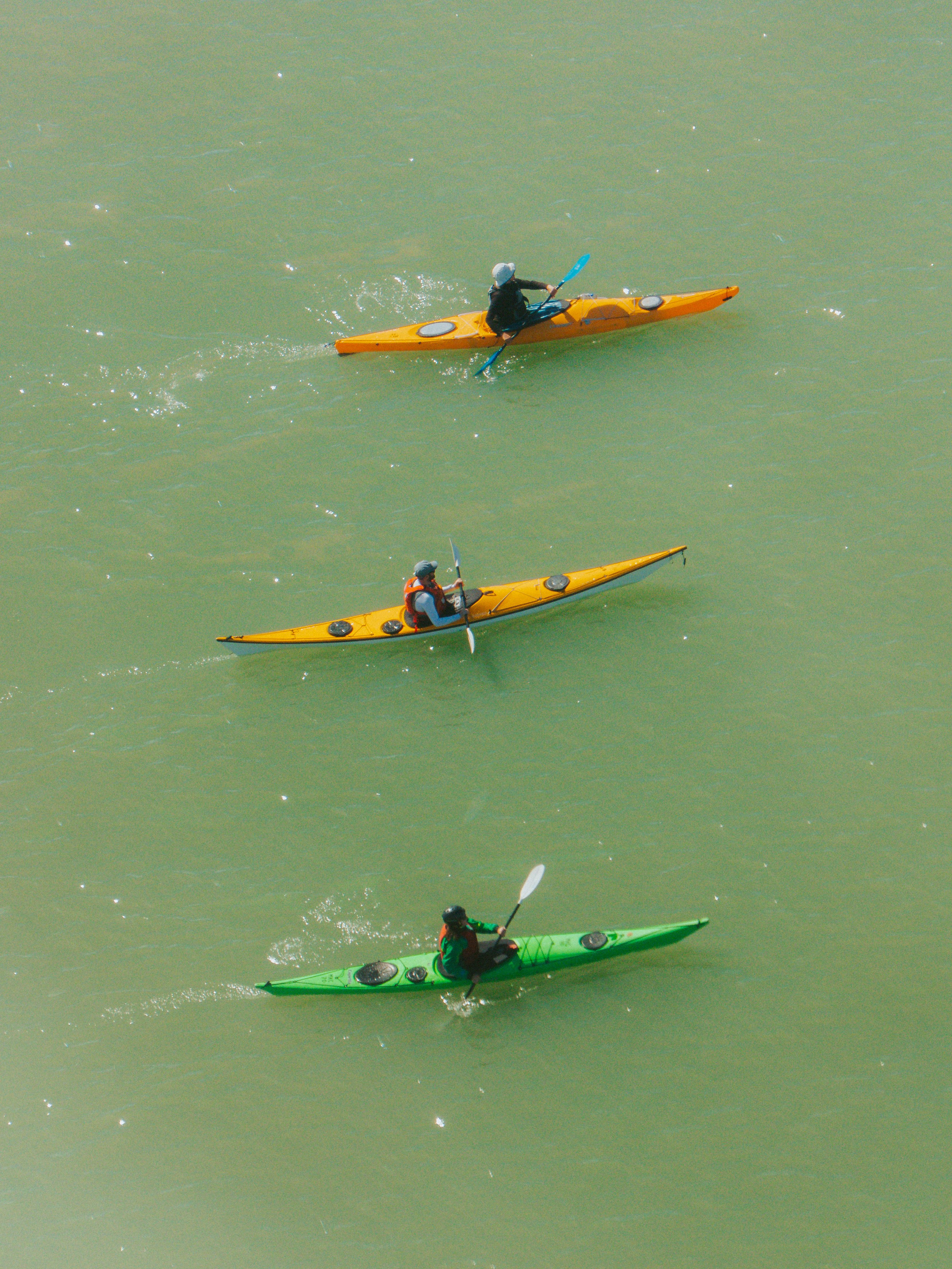 Aerial View of Three Kayaks on Calm Water · Free Stock Photo