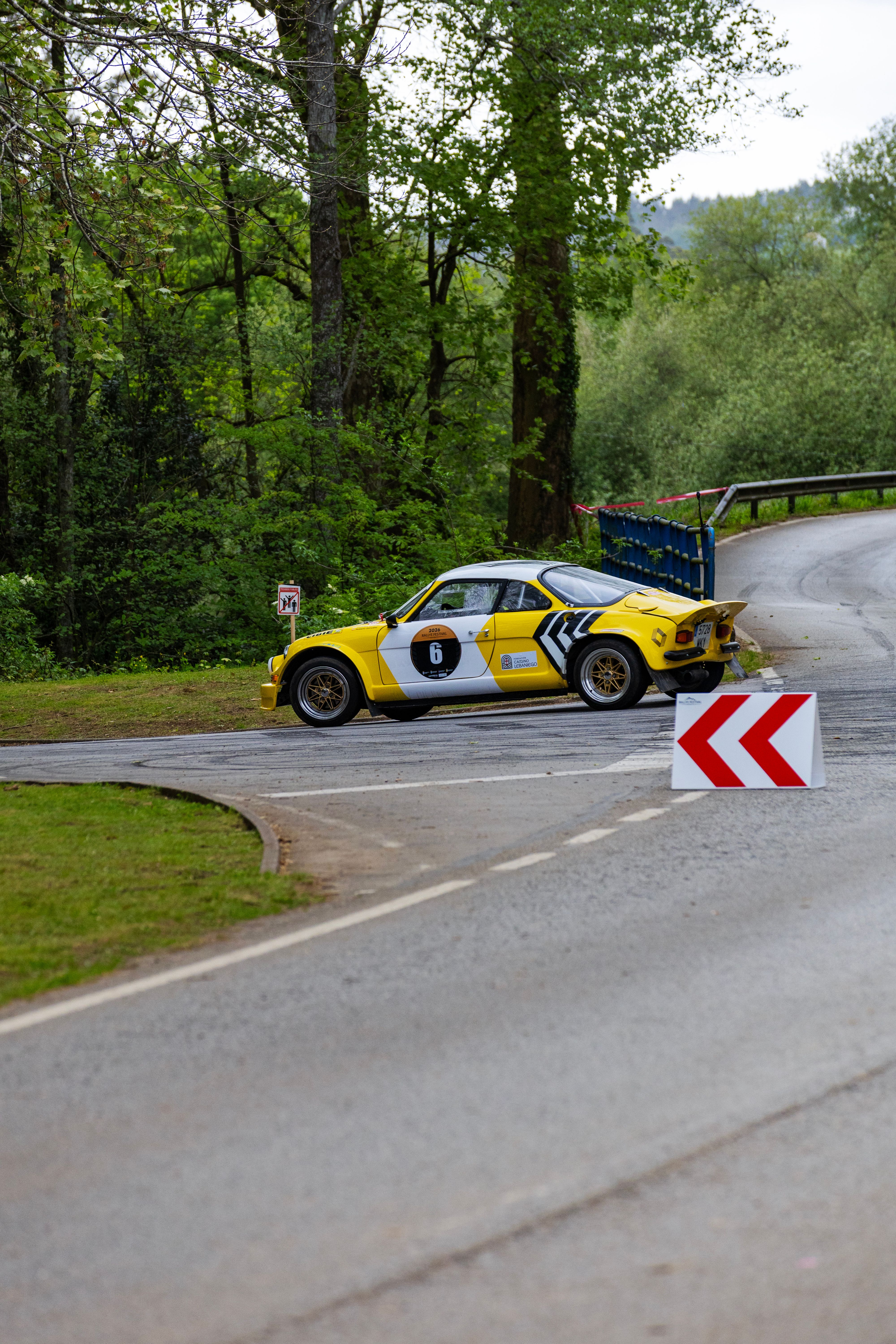 Vintage Rally Car on Scenic Forest Road · Free Stock Photo