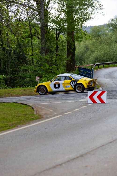 Sharpness Car Rally Vintage Rally Car on Scenic Forest Road · Free Stock Photo