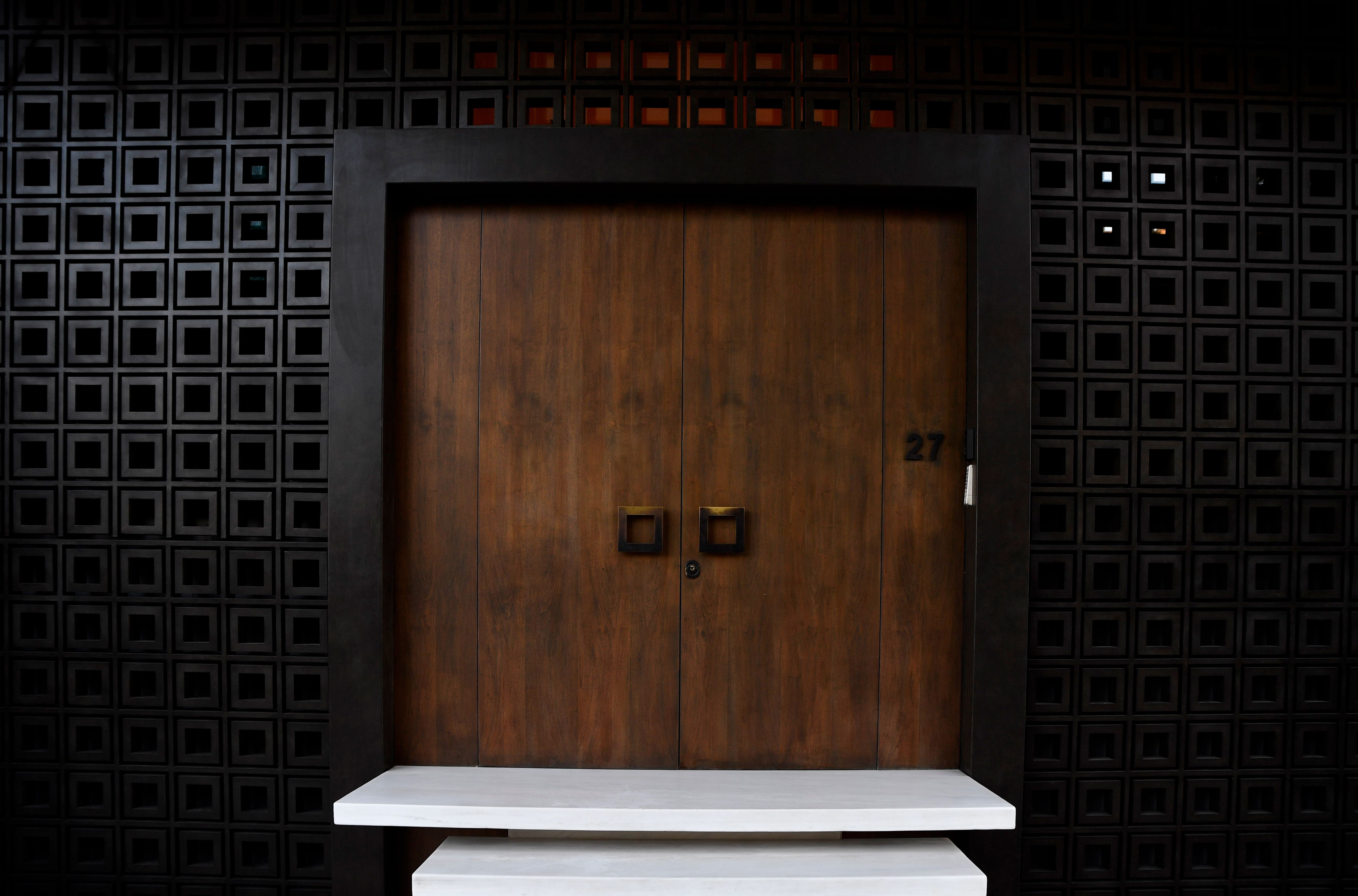 Contemporary wooden entrance with geometric patterns in Athens, Greece. Modern and minimalist design.
