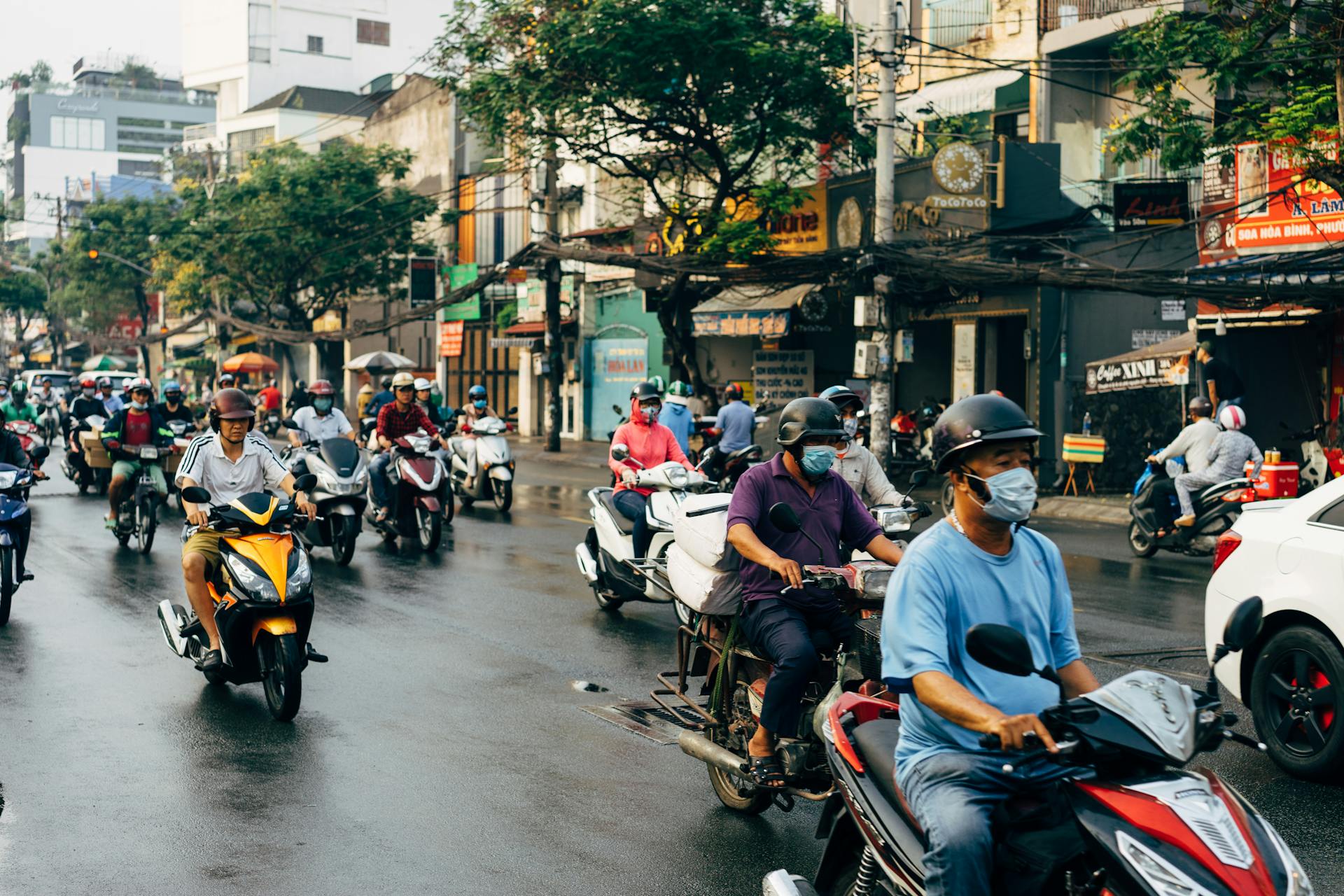 People Riding Motorcycle on Road