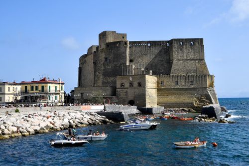 Free Explore the historic Castel dell'Ovo on a bright summer day in Naples, Italy's waterfront. Stock Photo