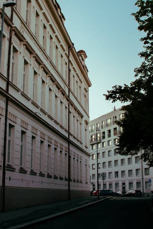 Free Charming street scene showcasing classic European architecture with elegant facades at dusk. Stock Photo