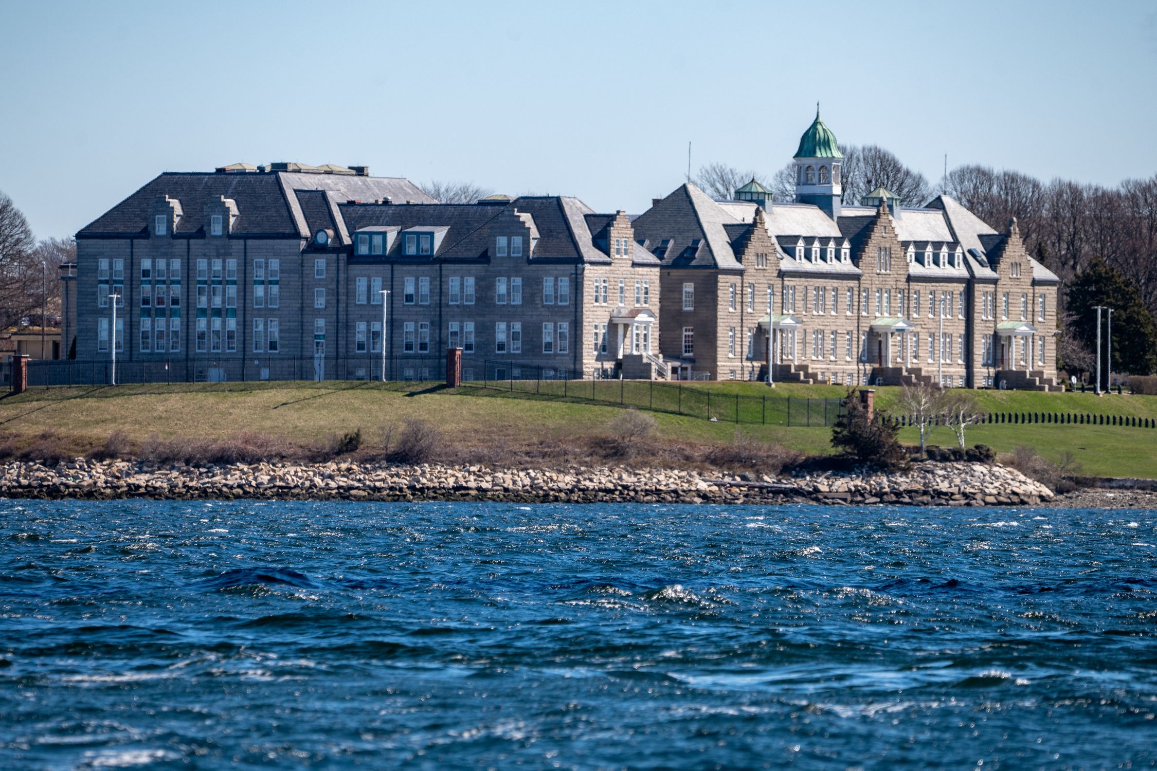 A historic naval building by the waterfront of Narragansett Bay in Newport, Rhode Island.