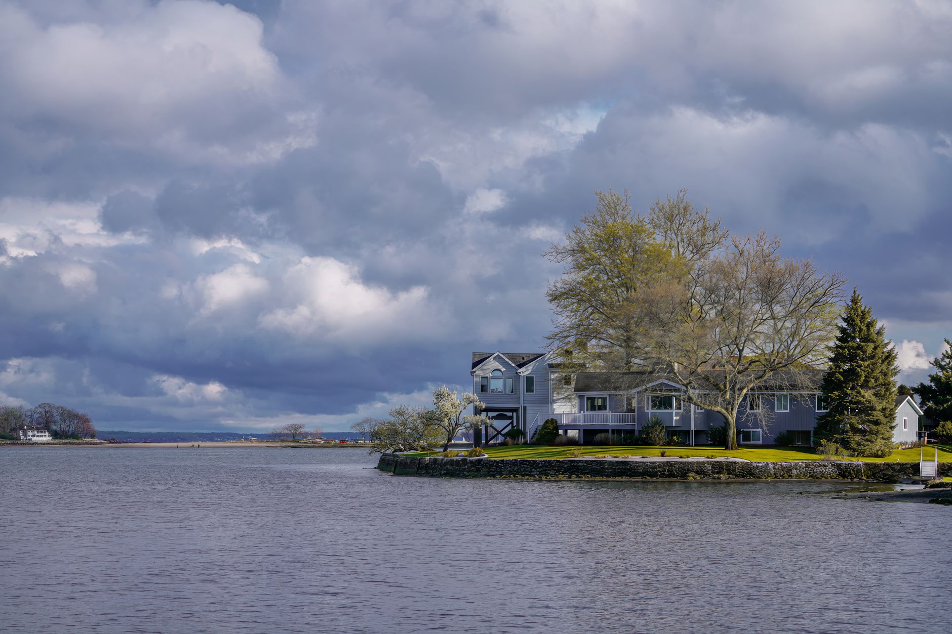 Residential neighborhood near New Bedford's working waterfront with multi-family homes visible.