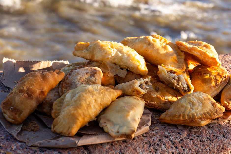 Freshly baked Maltese pastizzi, a savory pastry, from a local shop.