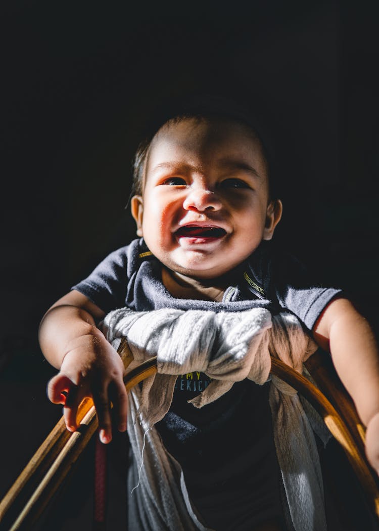 Happy Ethnic Infant In Baby Walker