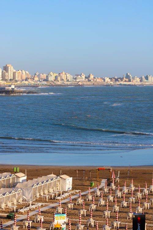 Free Aerial view of Mar del Plata's beach and cityscape with clear skies. Stock Photo