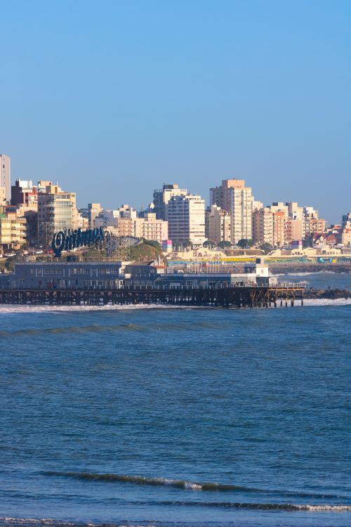 Free A stunning view of Mar del Plata's skyline and ocean with clear blue skies. Stock Photo