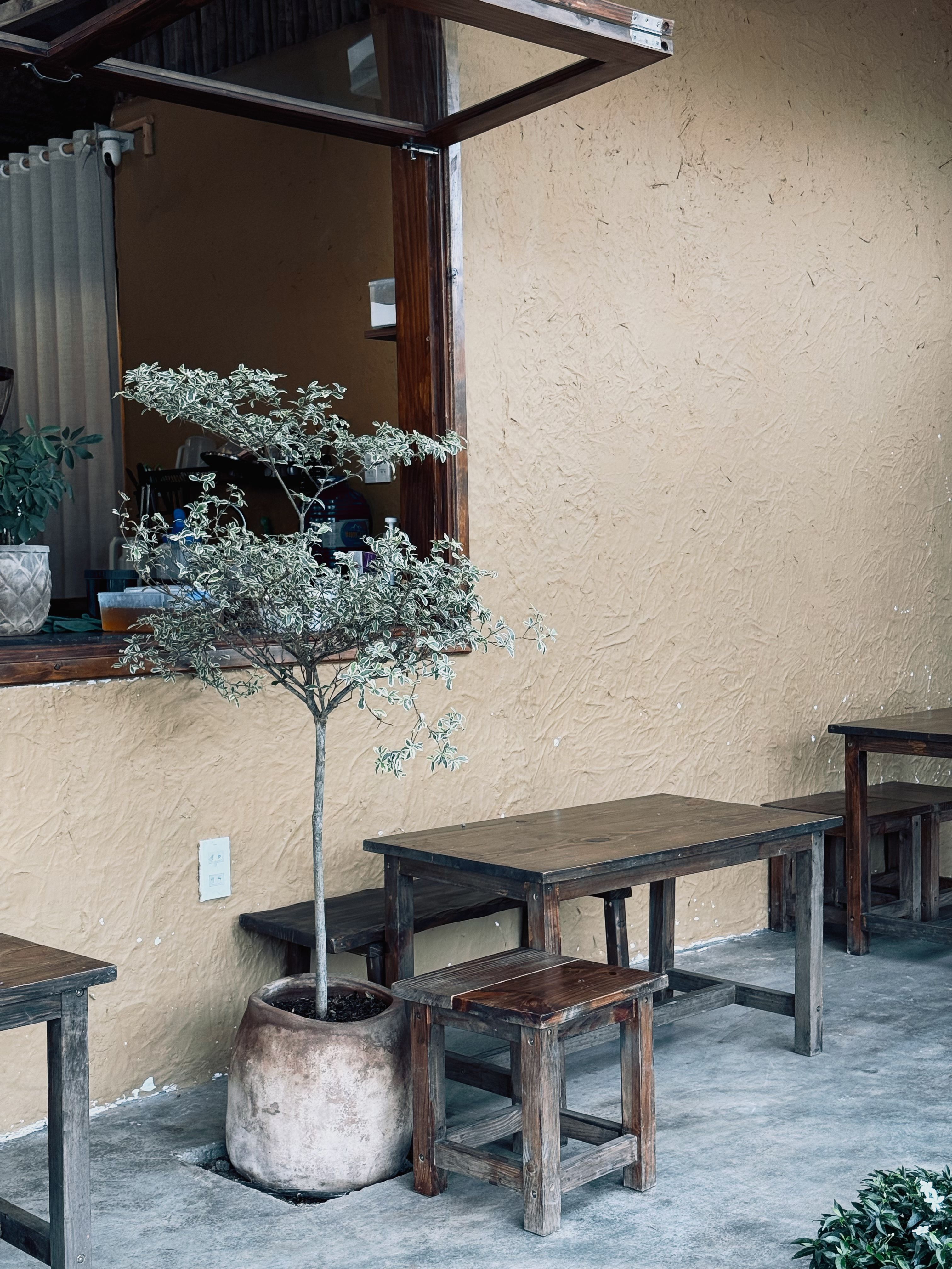 Cozy Outdoor Cafe with Rustic Seating in Vietnam · Free Stock Photo