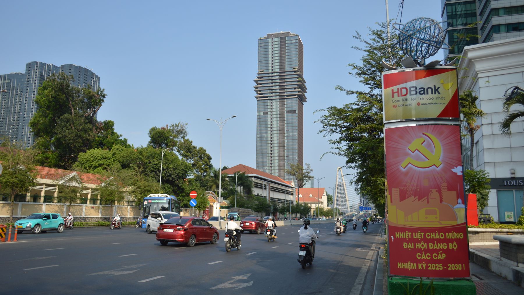Street view in Ho Chi Minh City showcasing HD Bank signage and traffic.