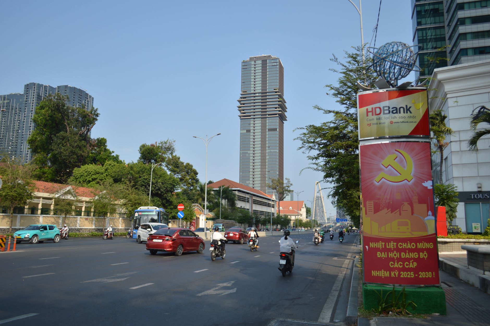 Street view in Ho Chi Minh City showcasing HD Bank signage and traffic.