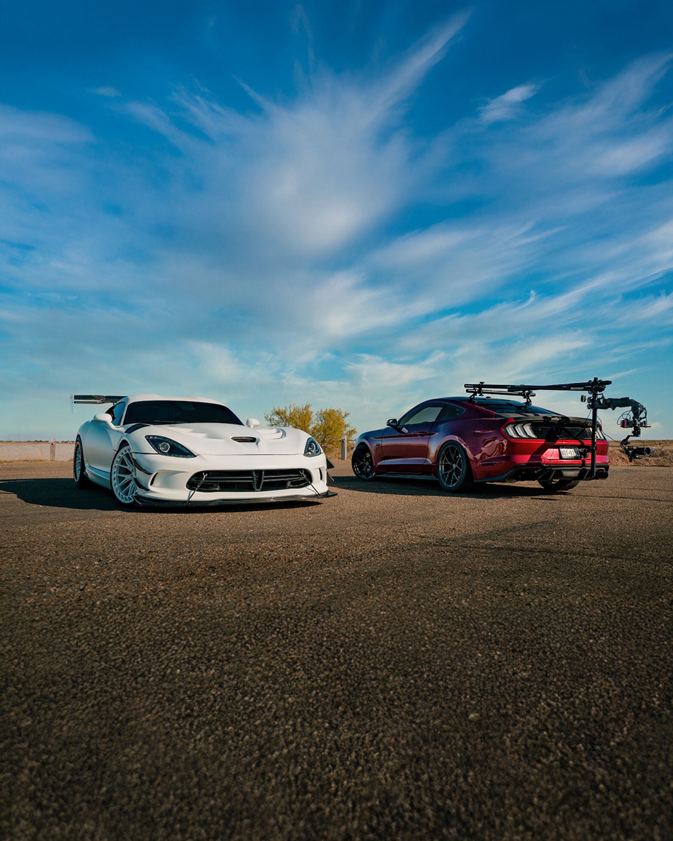 High-performance sports cars under blue sky · Free Stock Photo