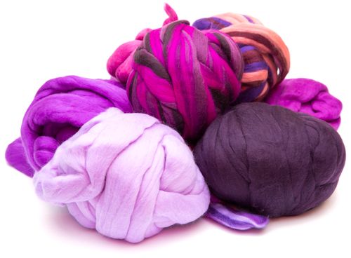 Free Bright and vivid wool roving in purple and pink tones, perfect for crafting and felting enthusiasts. Stock Photo