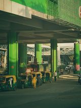 Auto rickshaws under an overpass, Delhi