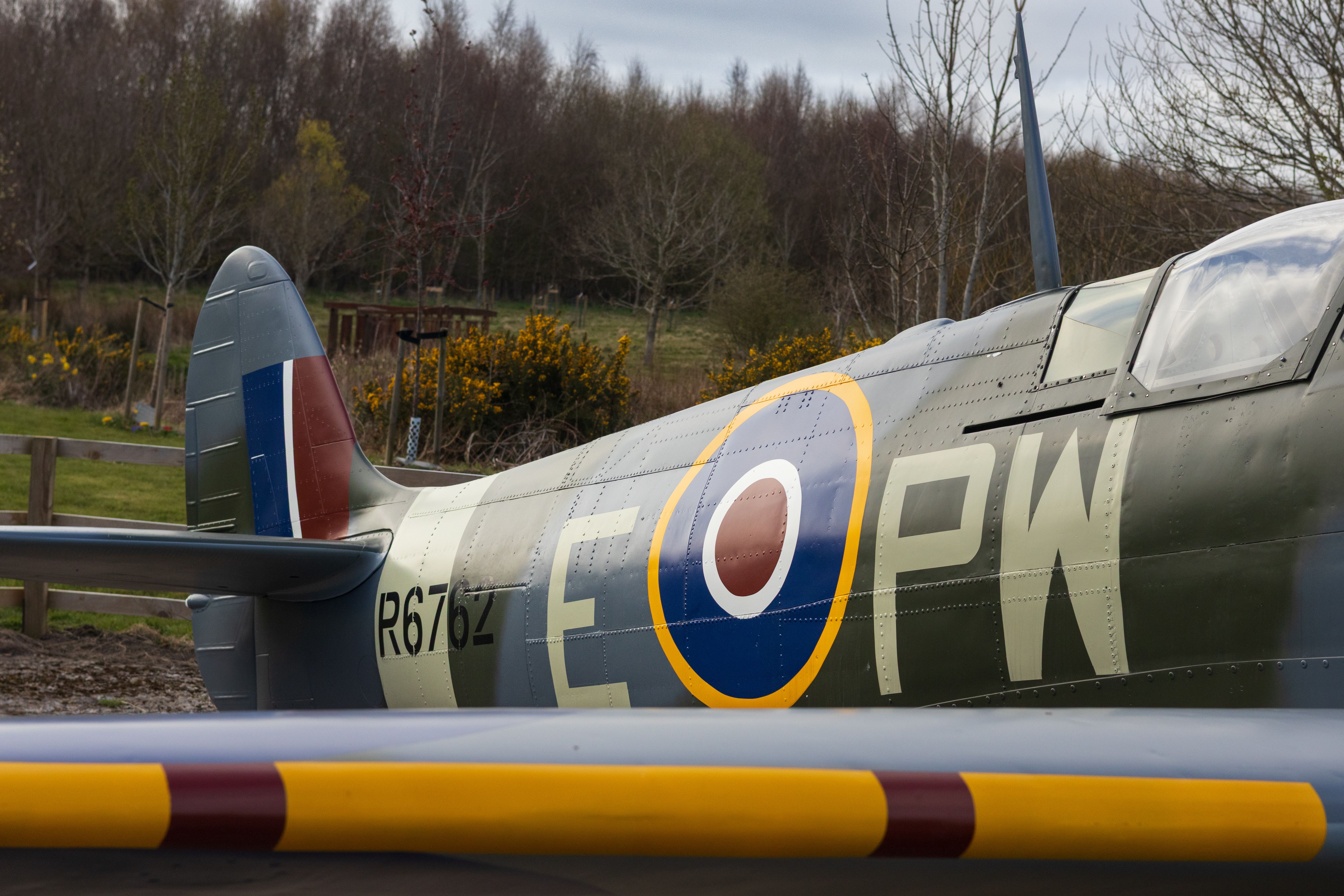 Rear View of Vintage Spitfire Aircraft Outdoors · Free Stock Photo