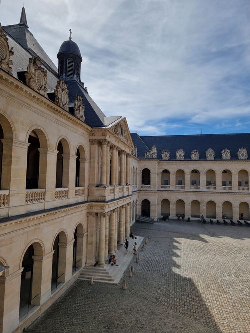 Free Intricate facade of Les Invalides in Paris under a bright blue sky. Stock Photo