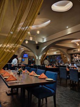 Modern restaurant interior with elegant decor and cozy ambience, perfect for dining.