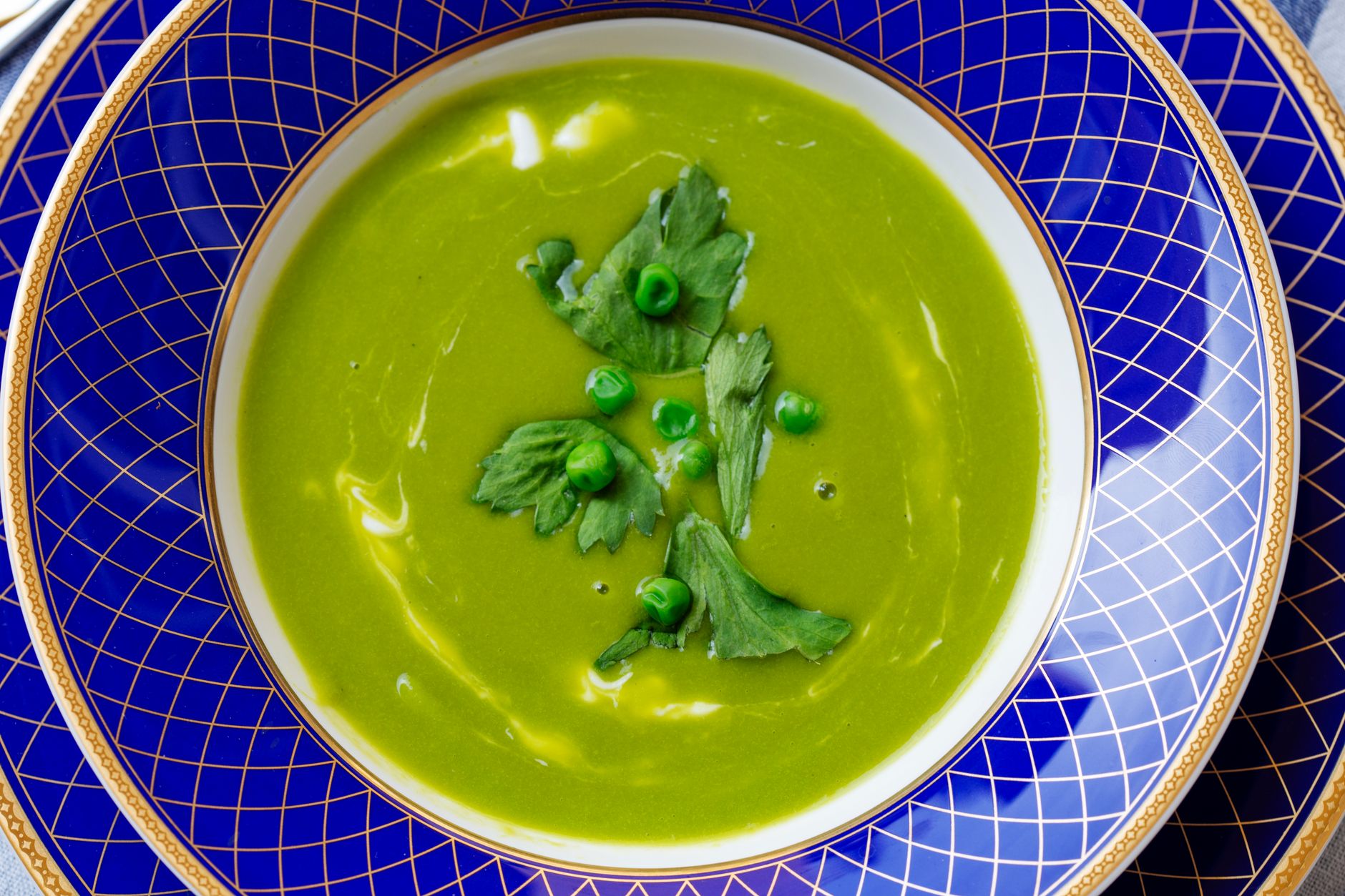 Green peas with herbs and cheese in a bowl