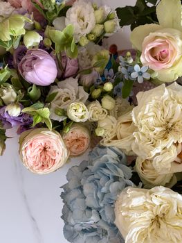 Colorful floral bouquet featuring roses, tulips, hydrangeas, and lisianthus.