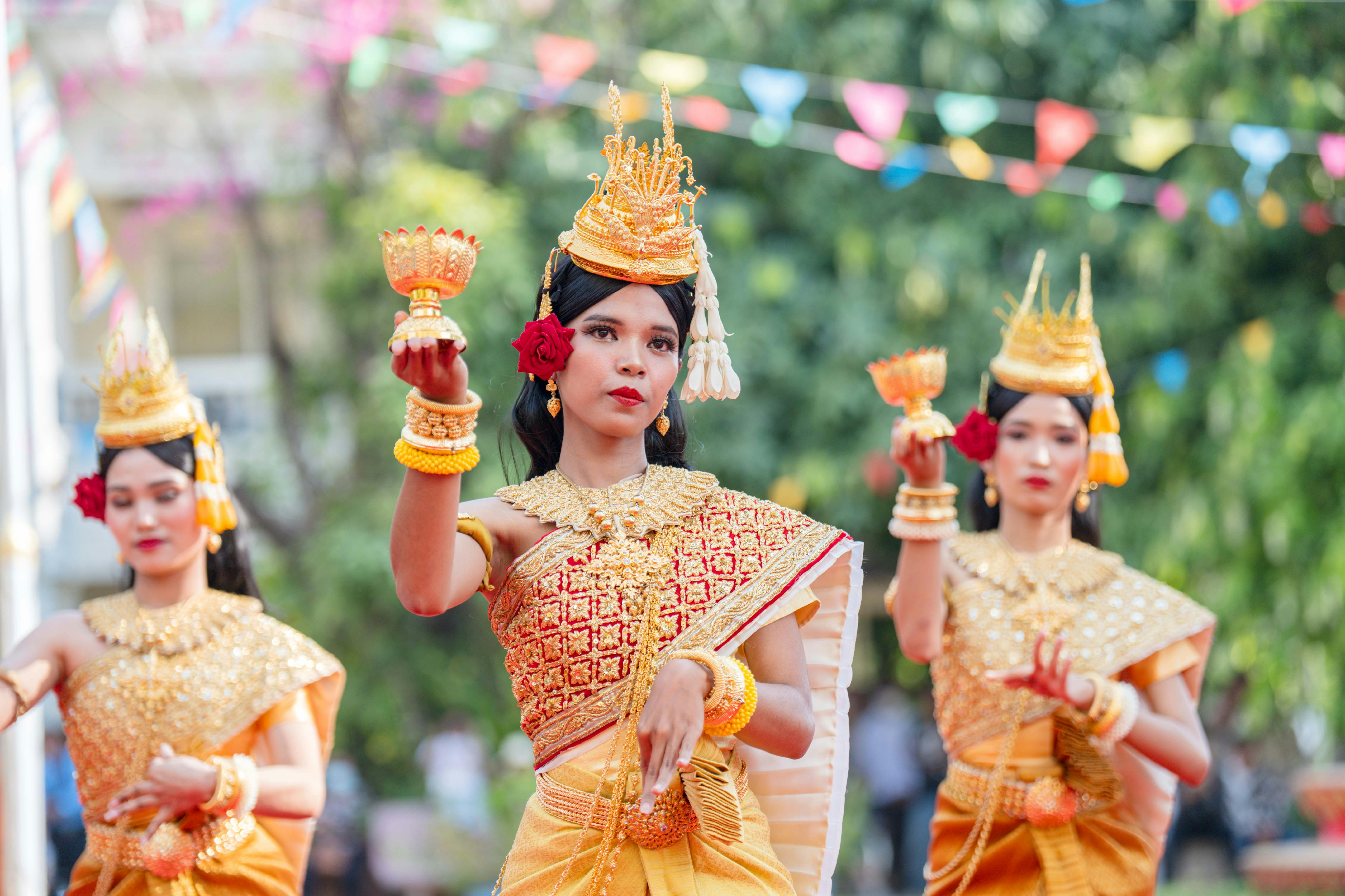 Colorful Apsara dancers in traditional attire performing in Cambodia