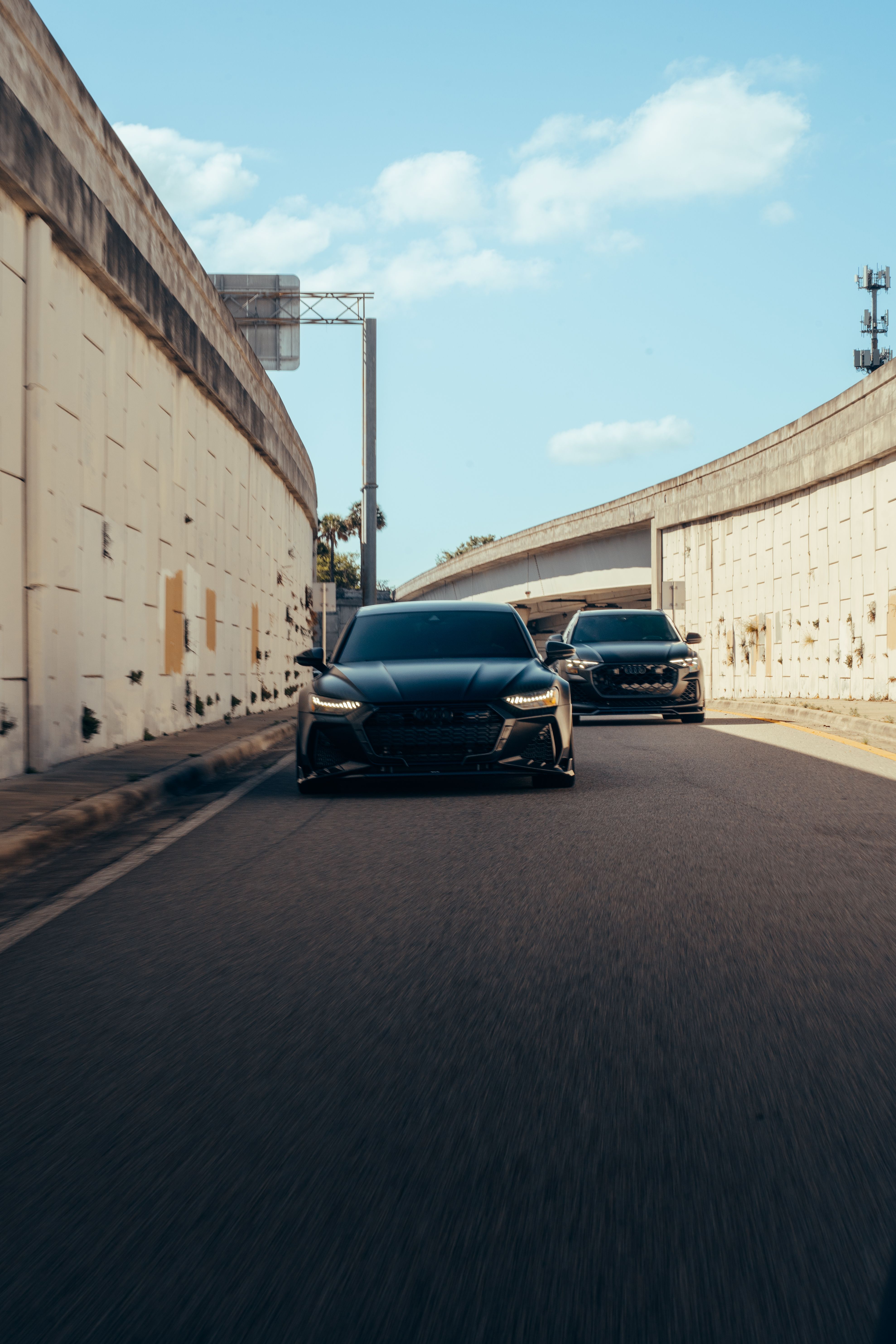 Modern cars driving through urban underpass · Free Stock Photo