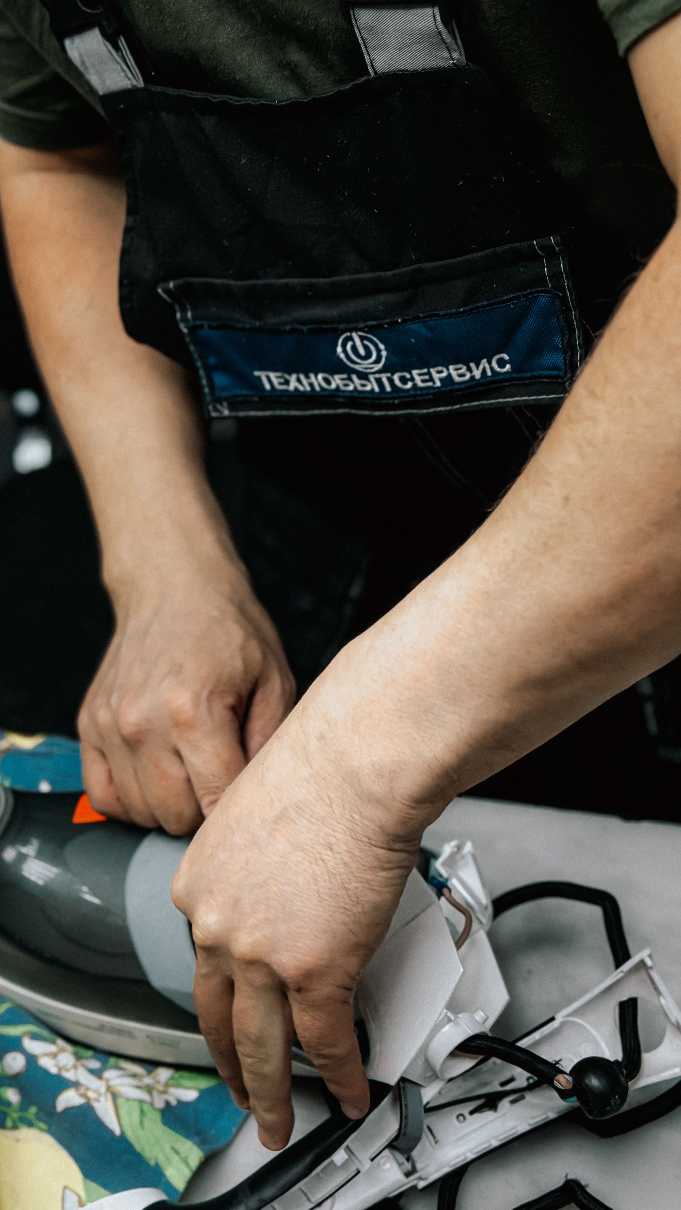Appliance repair technician working on a home appliance