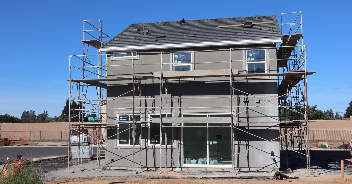 Scaffolding surrounds a new home under construction in Elk Grove, California.