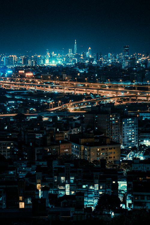 Vibrant Night Cityscape with Glowing Skyline · Free Stock Photo
