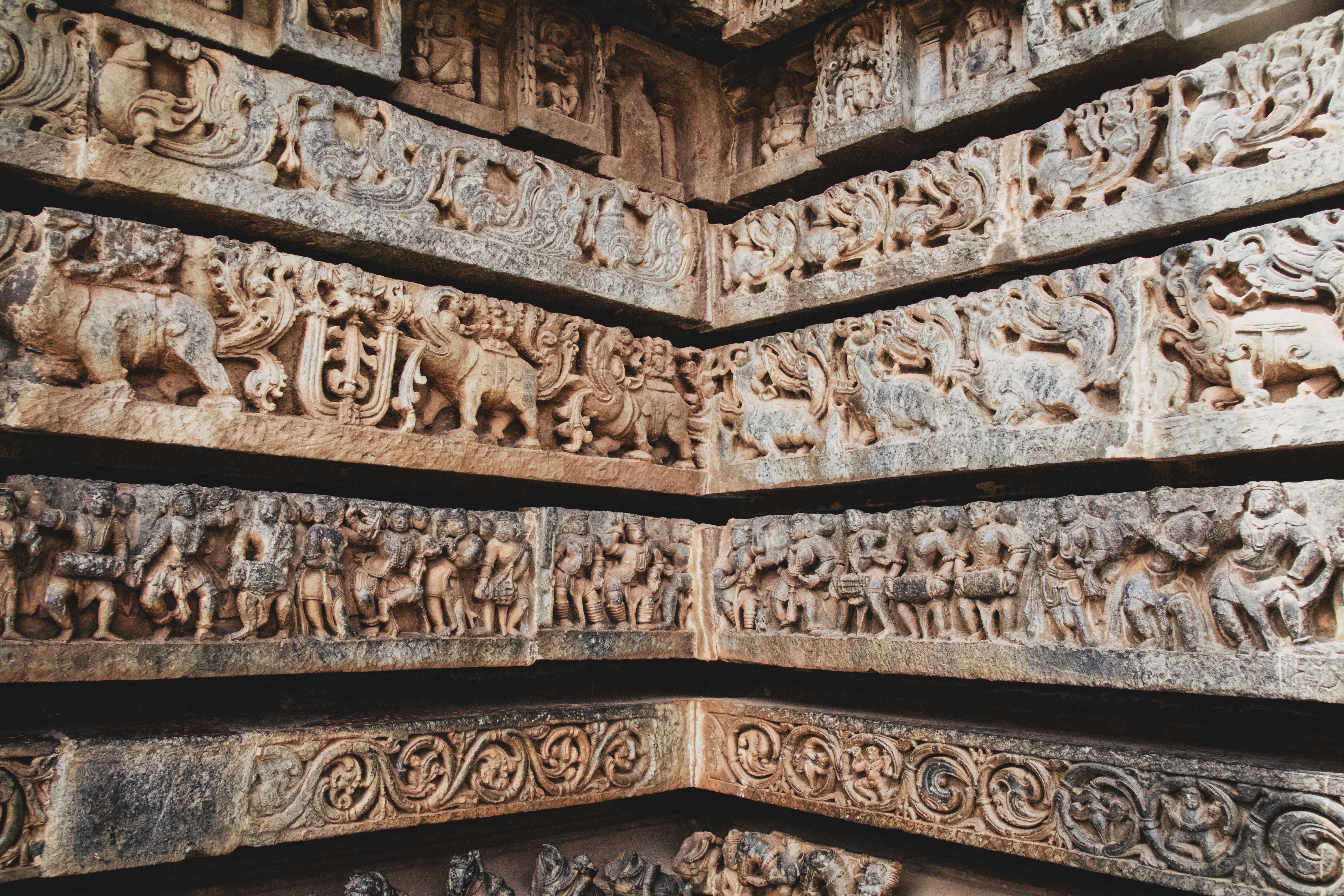 Intricate Ancient Stone Carvings on Temple Wall · Free Stock Photo