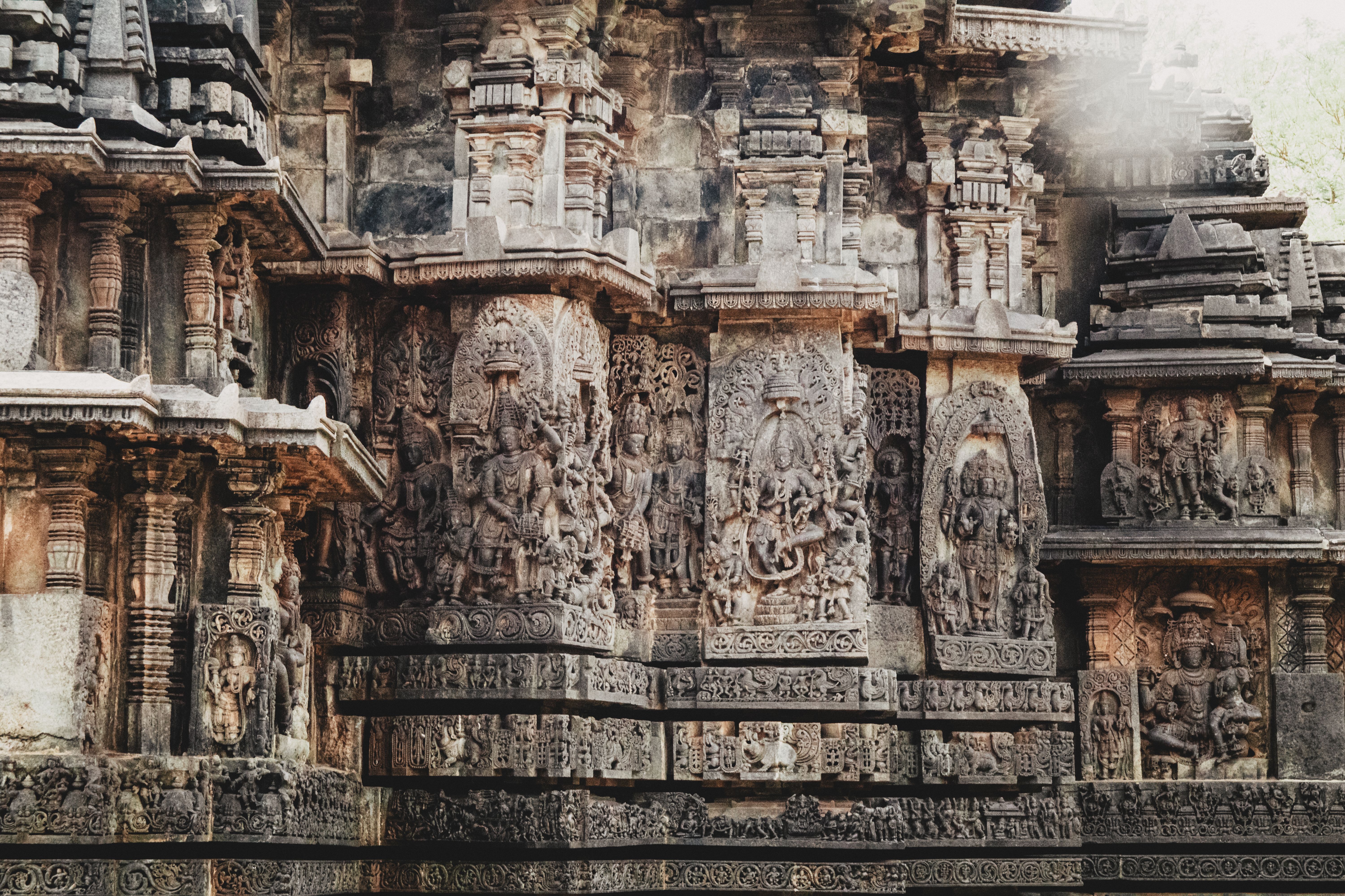 Ancient Stone Carvings on Temple Wall · Free Stock Photo
