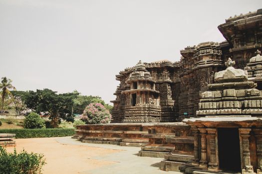 Detailed view of intricate stone carvings on an ancient temple facade, showcasing historical architecture.