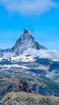 Breathtaking view of the Matterhorn peak against a clear blue sky, ideal for travel enthusiasts.