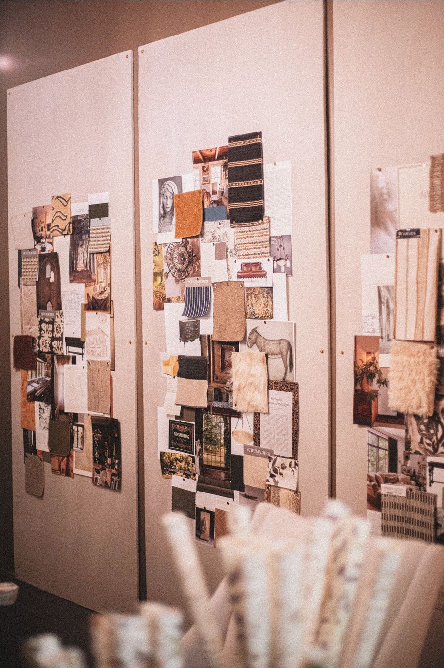 Material boards and finish samples pinned up in a design studio