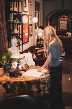 Explore a cozy boutique interior with vintage decor and warm tones in Greenville, South Carolina.