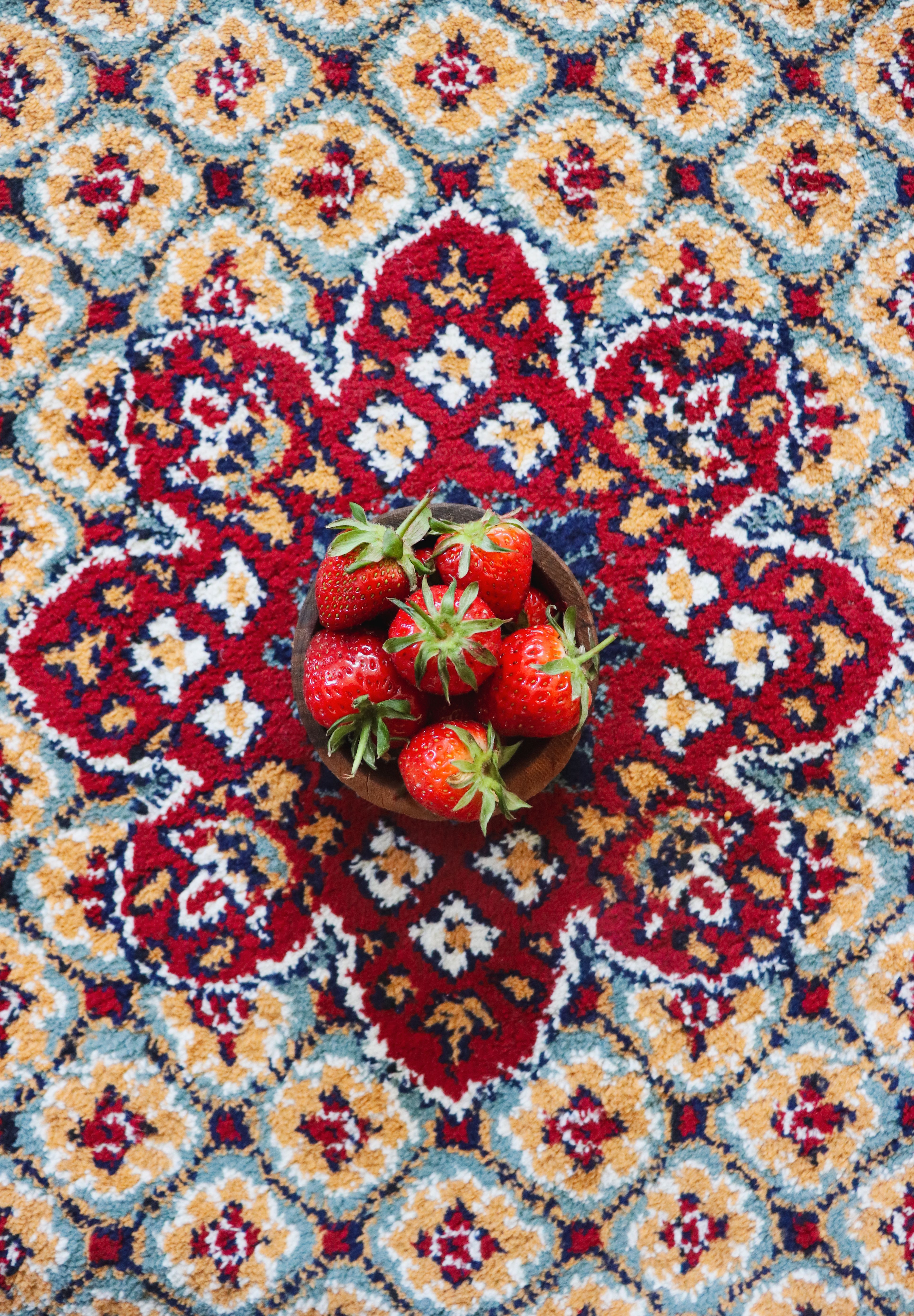 Vibrant Strawberries on Ornate Persian Carpet · Free Stock Photo