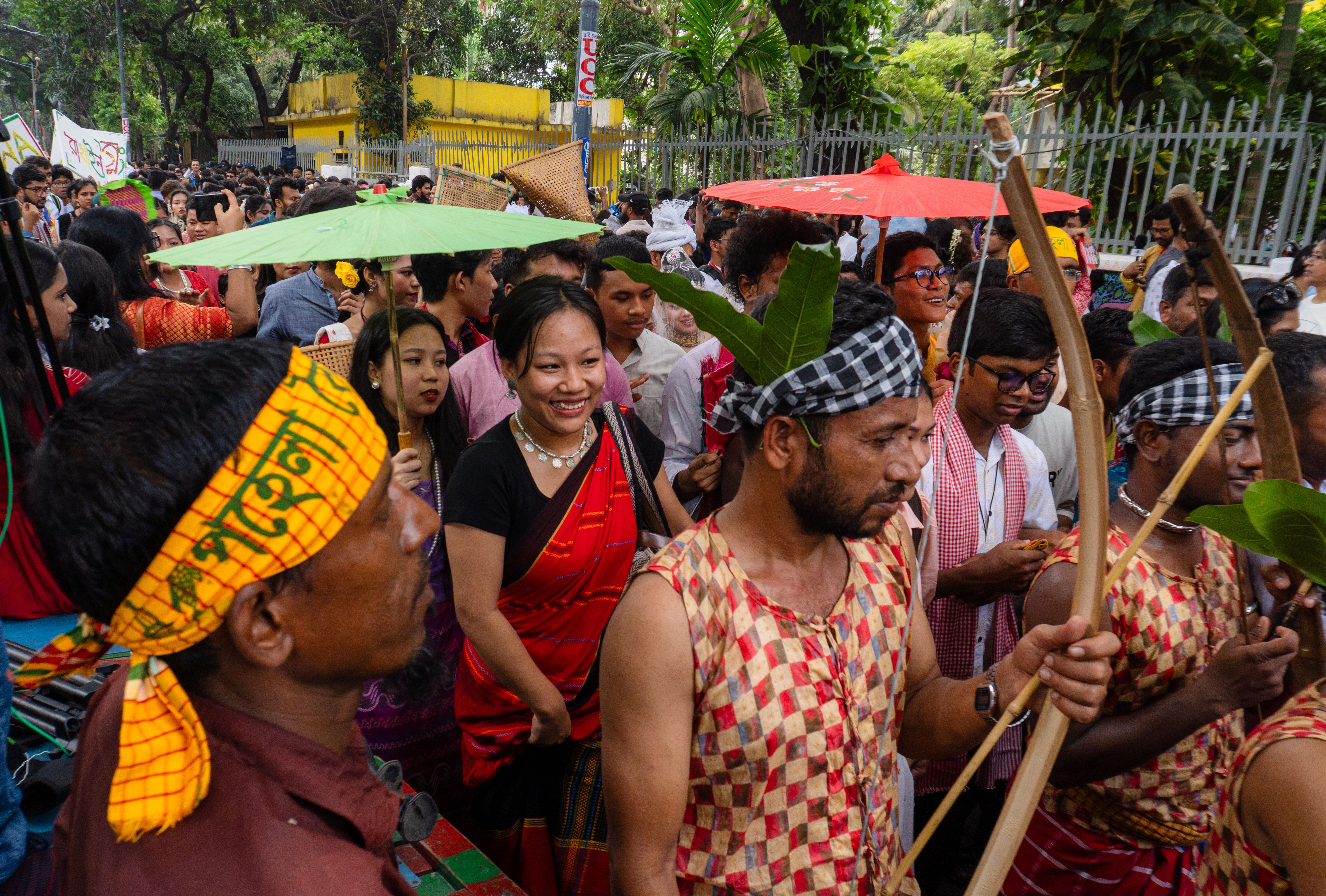 Vibrant parade in Dhaka showcasing traditional clothing and cultural celebration.