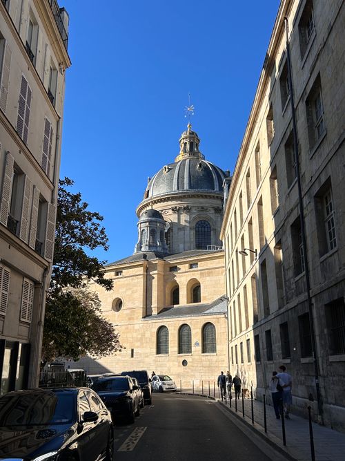 Free A clear, sunny day view of the historic Institut de France in Paris, framed by classic architecture. Stock Photo