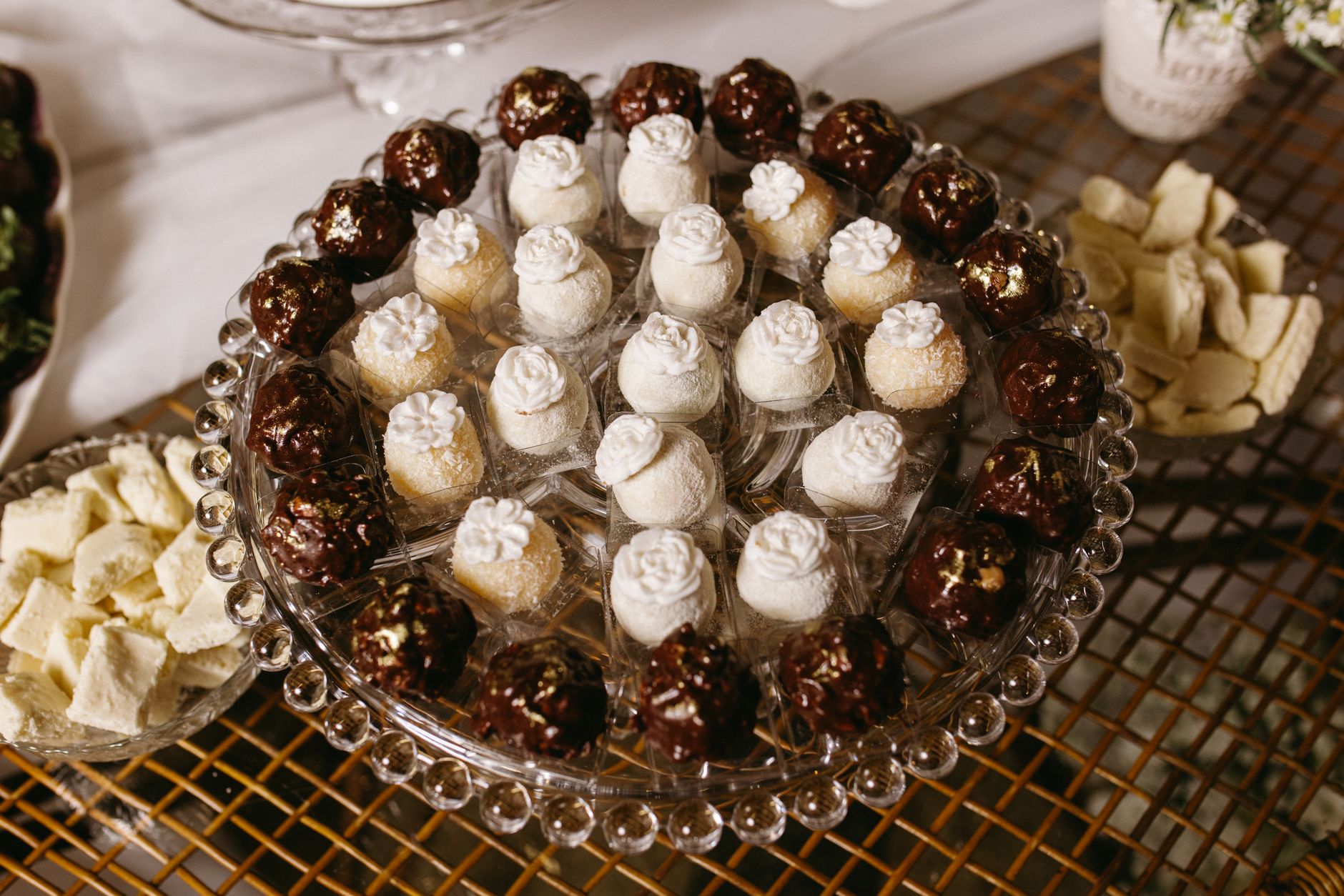 A beautifully arranged dessert platter with various chocolate and cream-filled treats, perfect for events.