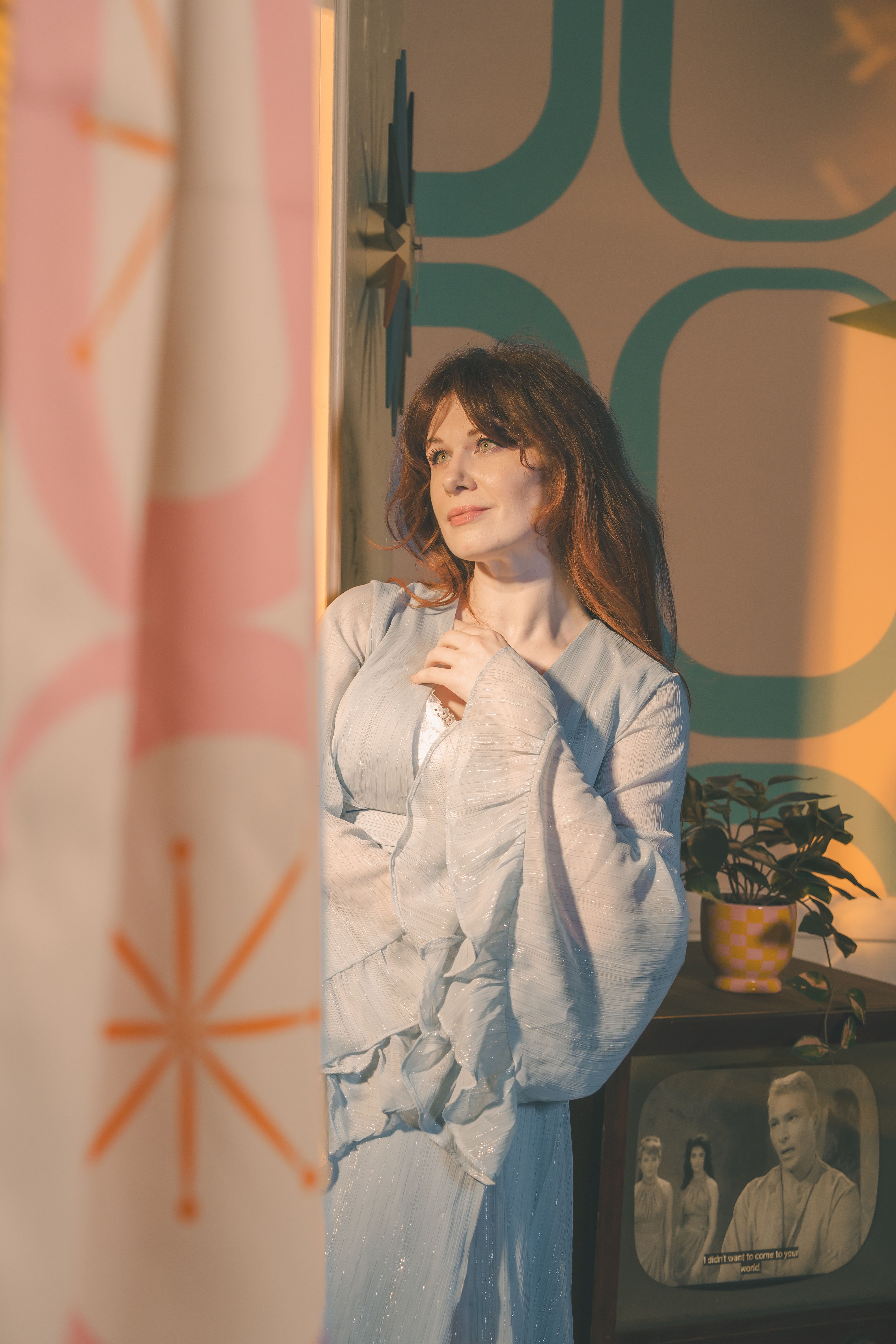 A woman in a retro interior, evoking a nostalgic vintage mood with mid-century design elements.