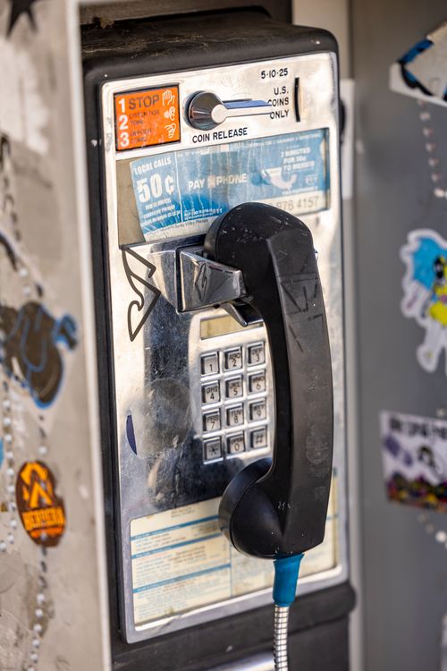 Free Close-up of vintage payphone with graffiti, evoking nostalgia and urban vibes. Stock Photo