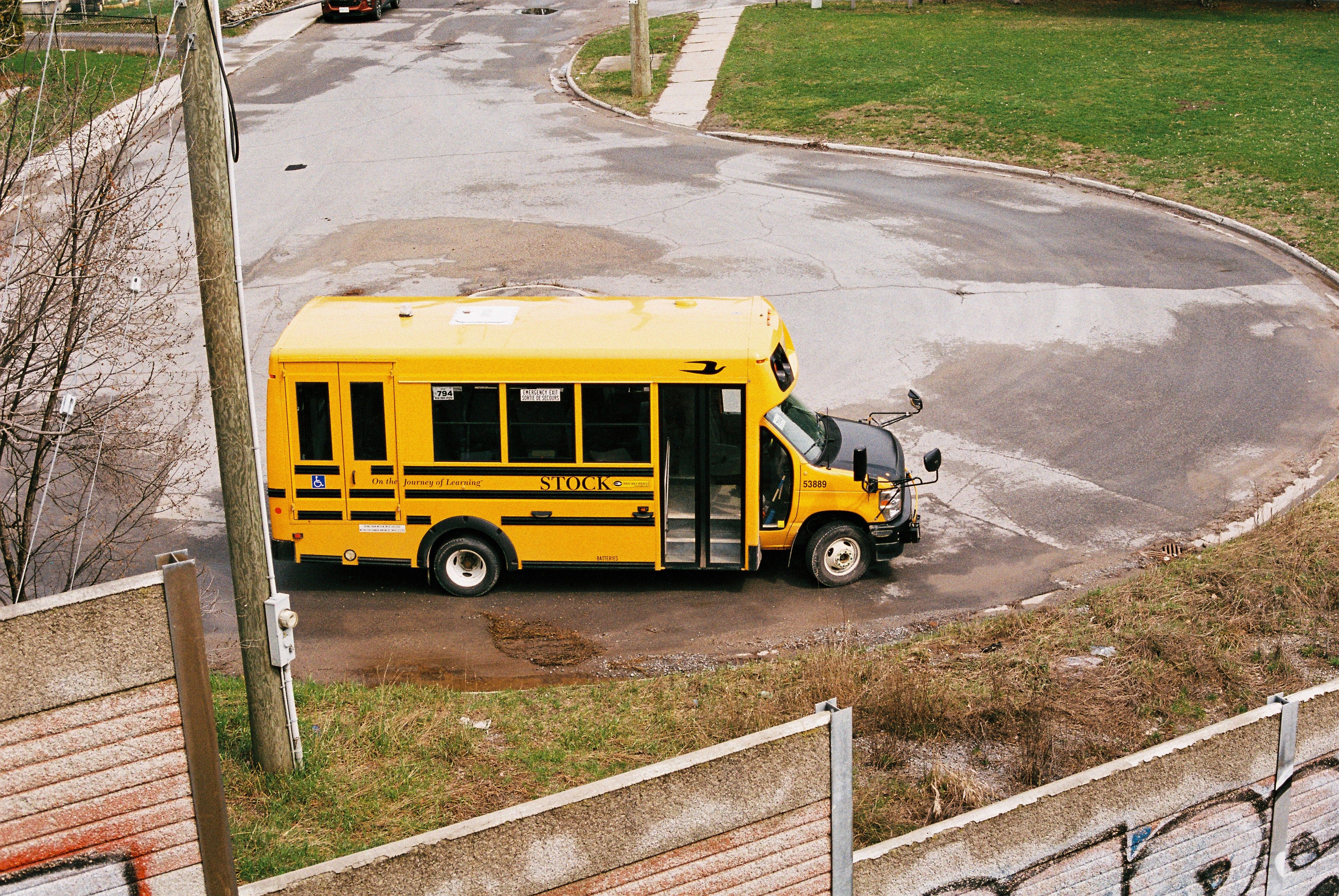 A yellow school bus on a suburban street, representing CCSD attendance zones across the Las Vegas valley