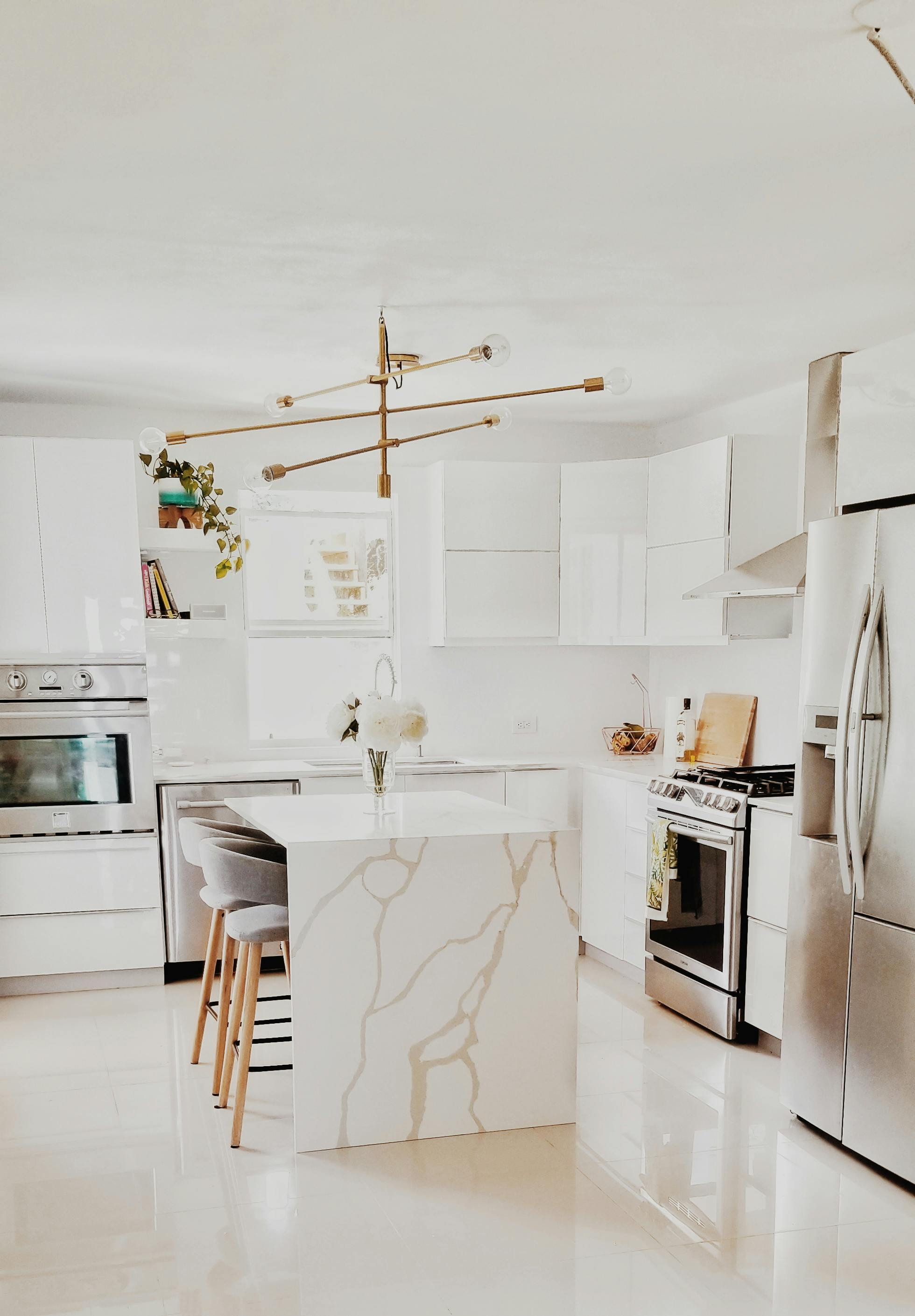 Beautiful Modern Kitchen Design Kitchen Faucet And Kitchen Décor Gray  Marble Kitchen Island Stock Photo - Download Image Now - iStock